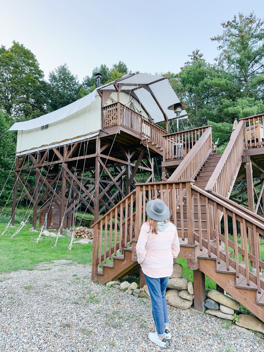 Tamara looking up at Highwood Retreat glamping tent