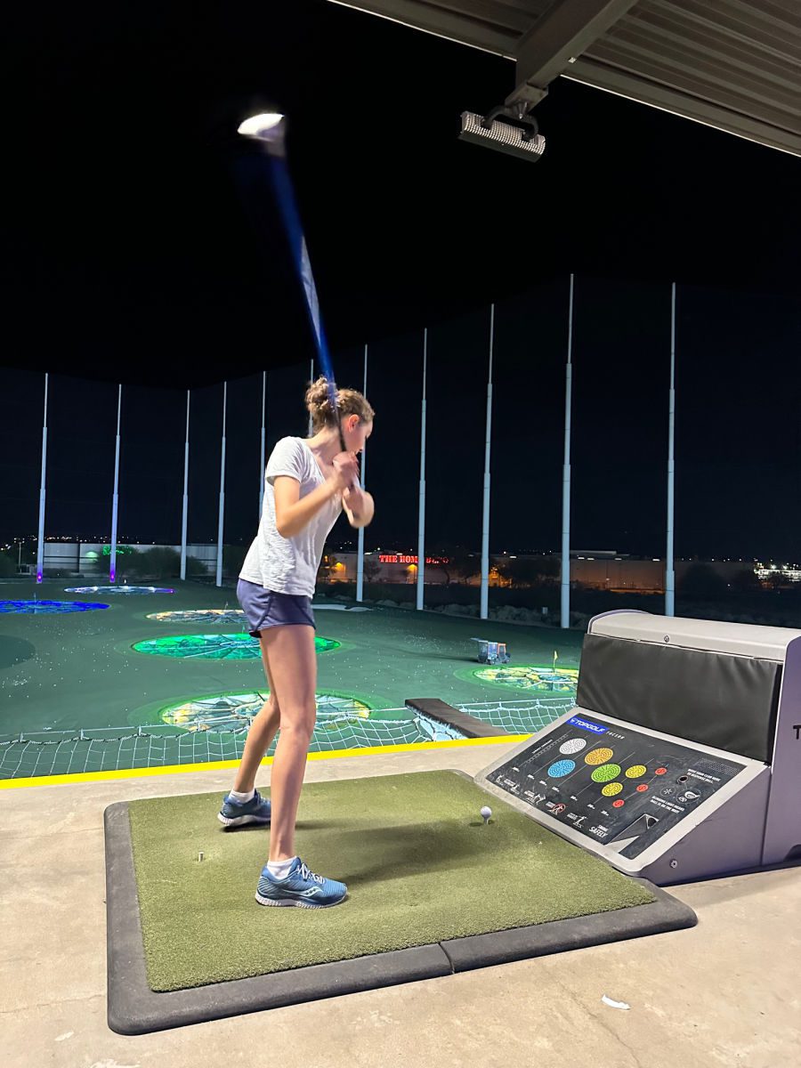 Hitting a ball at Top Golf