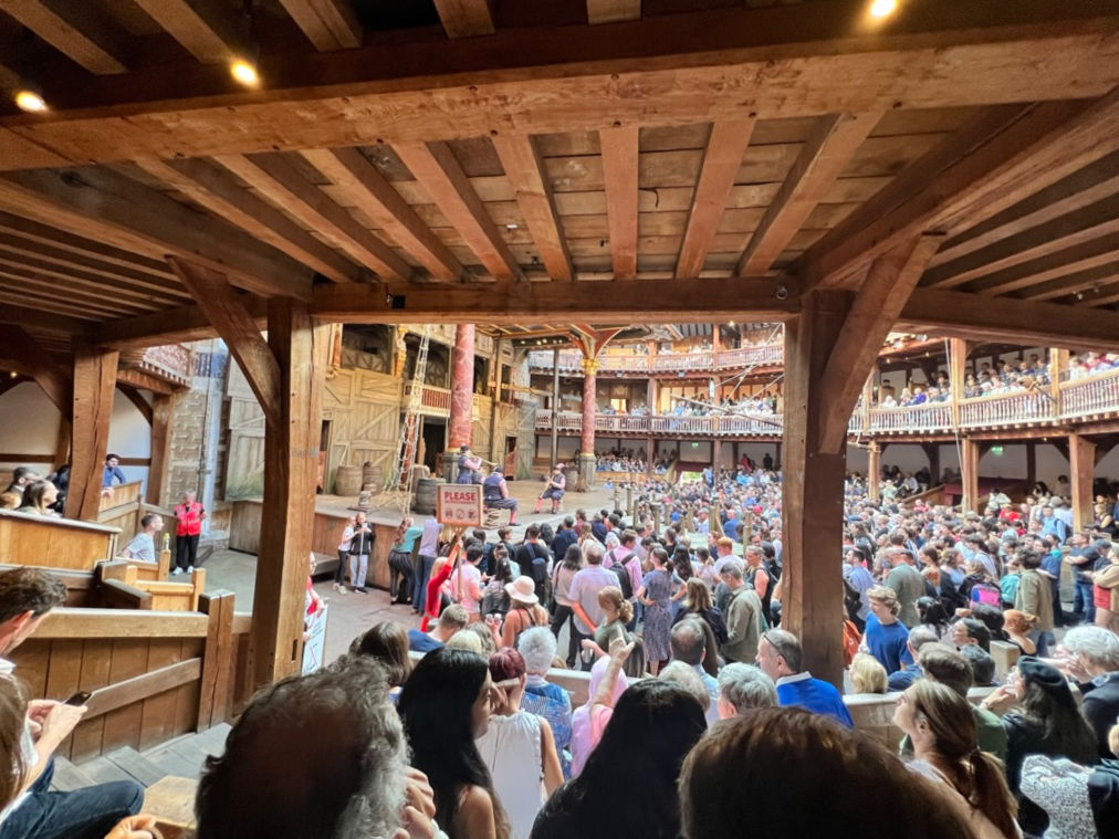 watching a show at the Globe Theater