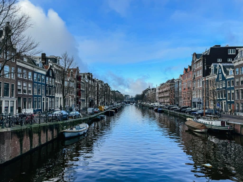 3 days in Amsterdam itinerary - canal with blue sky