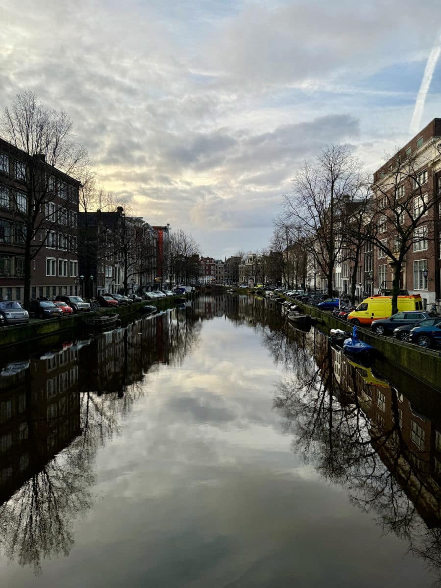 reflection of clouds in canal in Amsterdam