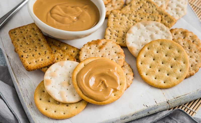 Nut-butter squeeze packs (≤3.4 oz / 100 ml) + whole-grain crackers