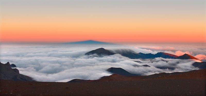 A Volcanic Peak Above the Clouds