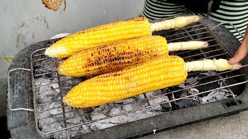 Mais (Boiled or Grilled Corn with Cheese and Butter)