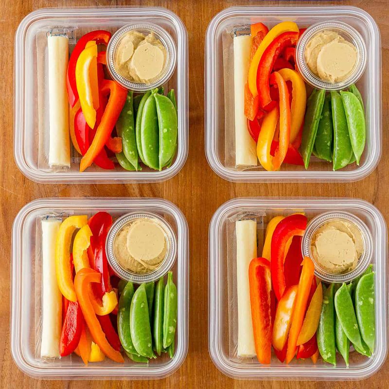 Cut veggies (carrots, snap peas, bell peppers) with hummus