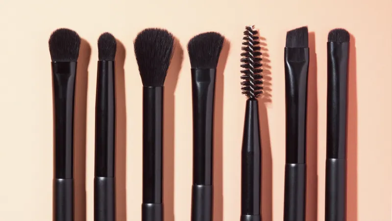 Clean your makeup brushes more often on the road.