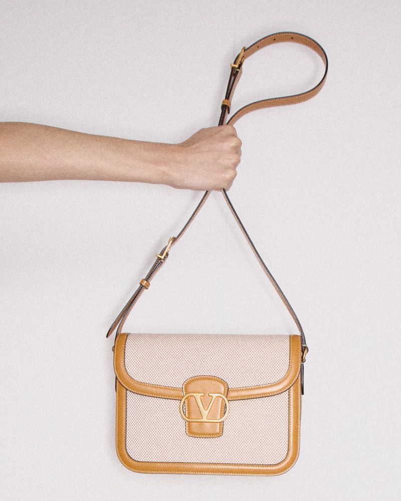 A slim crossbody or belt bag for “on-you” essentials