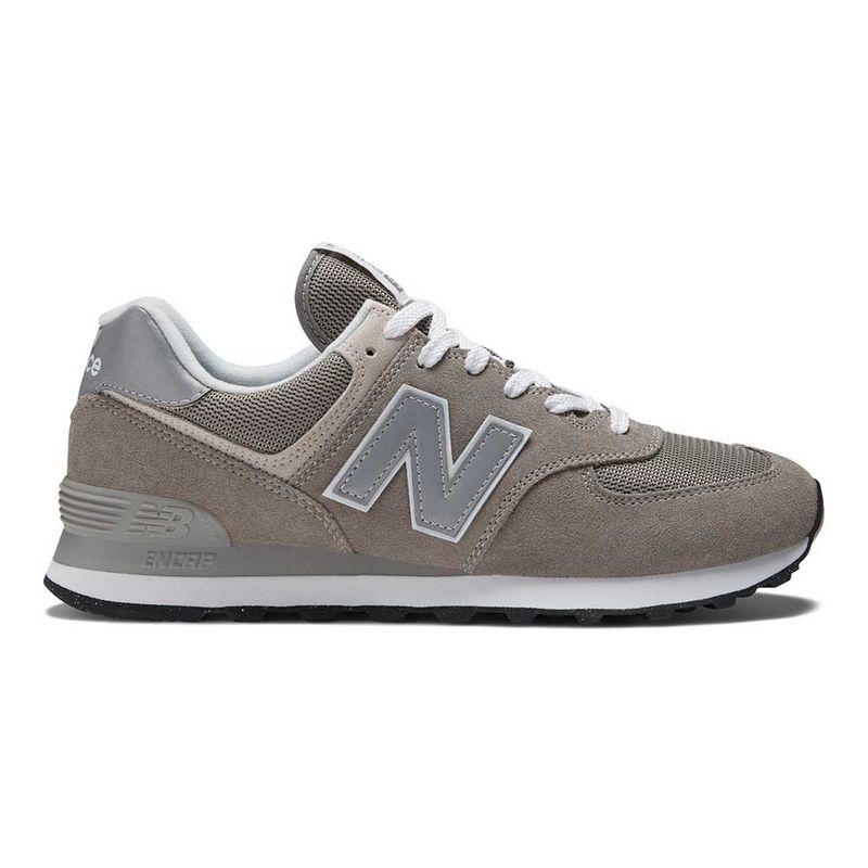 New Balance 574 (Wide) – Classic comfy sneaker with a roomy last and stable base, great for airport sprints and long city walks
