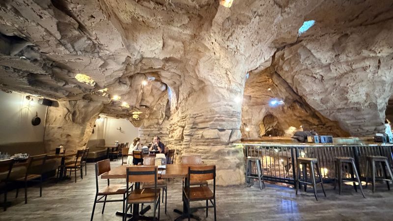 A Dining Room Built To Look Like Solid Rock