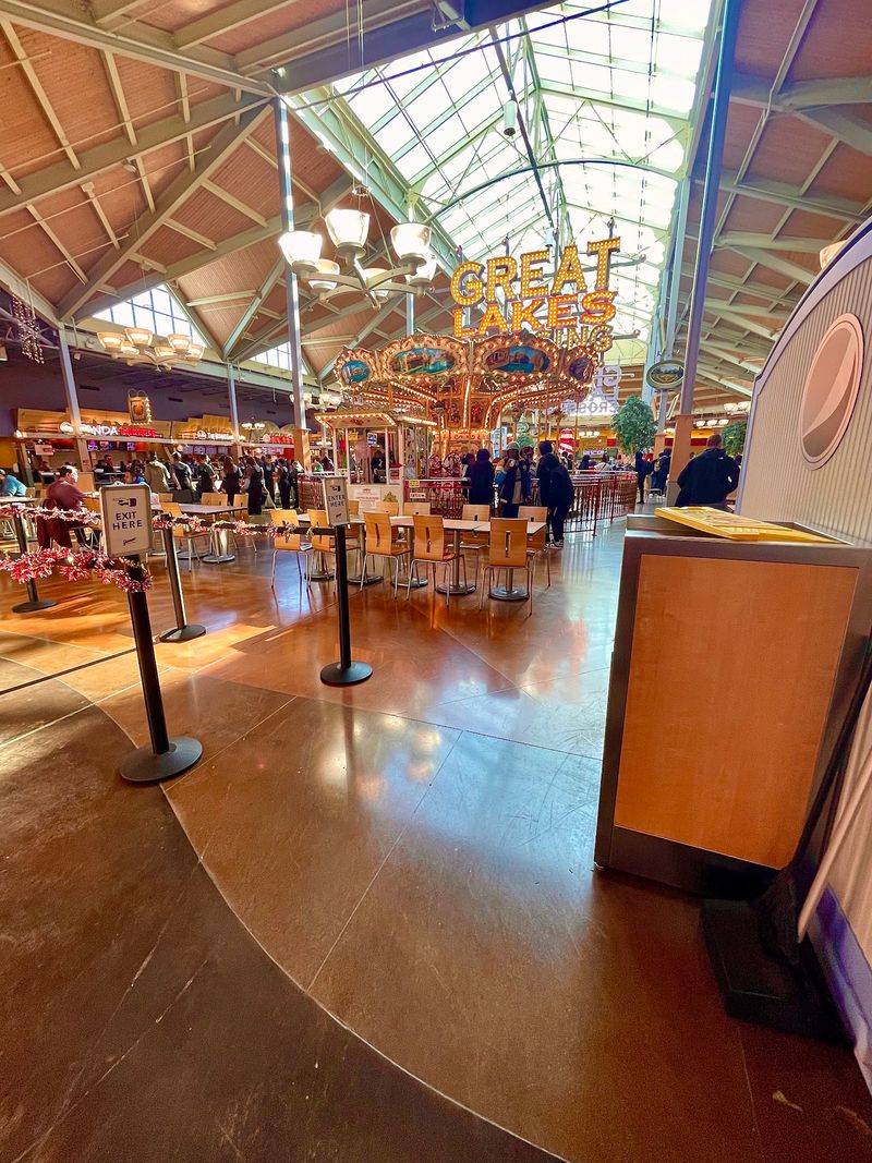A Food Court With A Carousel In The Middle