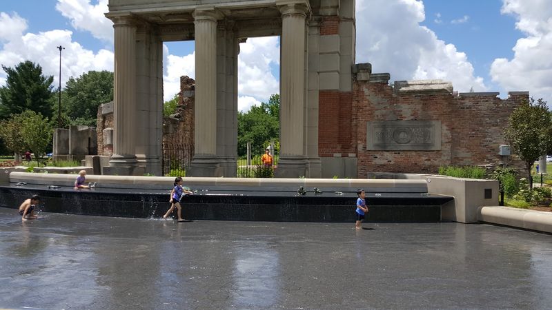 A Fountain, A Splash Pad, And Happy Kids A Fountain, A Splash Pad, And Happy Kids