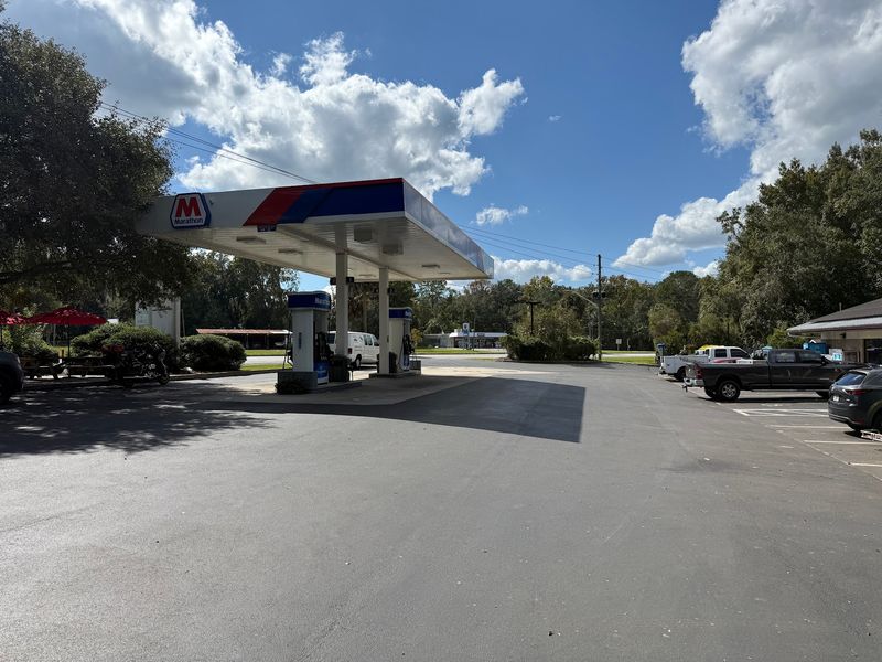 A Gas Station With a Smoker Out Back