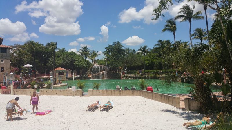 A Sandy Beach and Loungers for Sunbathers A Sandy Beach and Loungers for Sunbathers