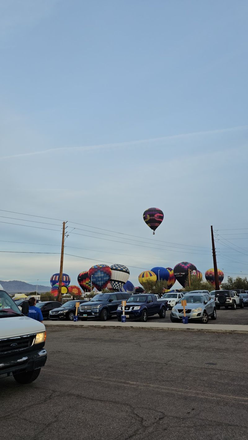 Balloons Rising Over The Desert Sky