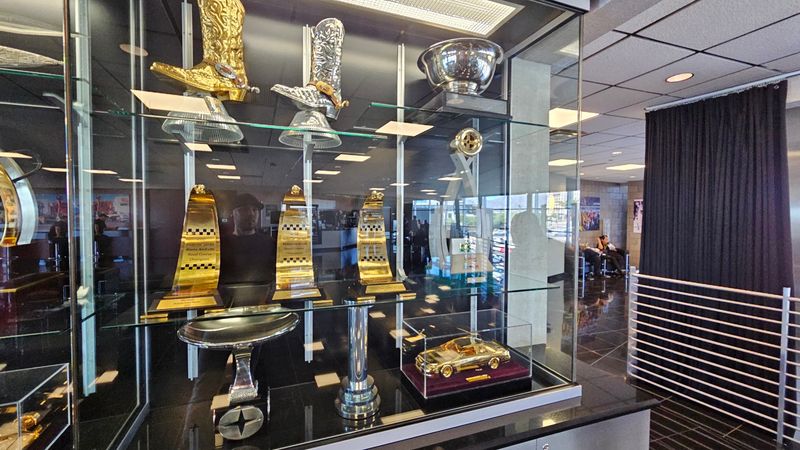Trophies, Photos, and a Wall of Wins