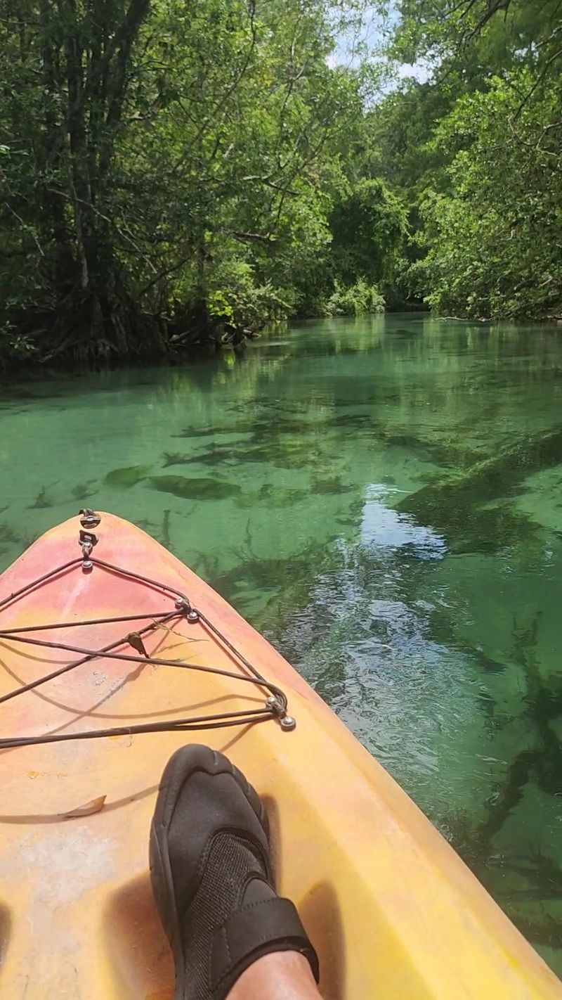 Kayaking Through Crystal Water Kayaking Through Crystal Water