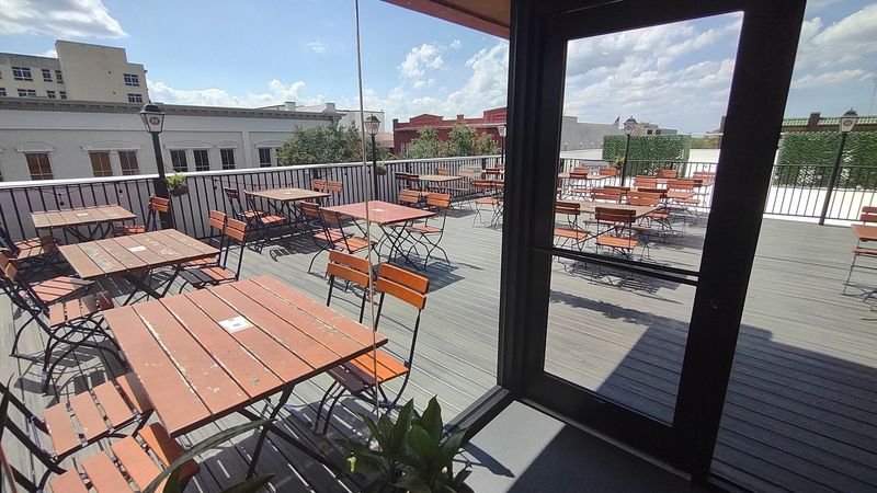 Rooftop Cornhole and Outdoor Seating Rooftop Cornhole and Outdoor Seating