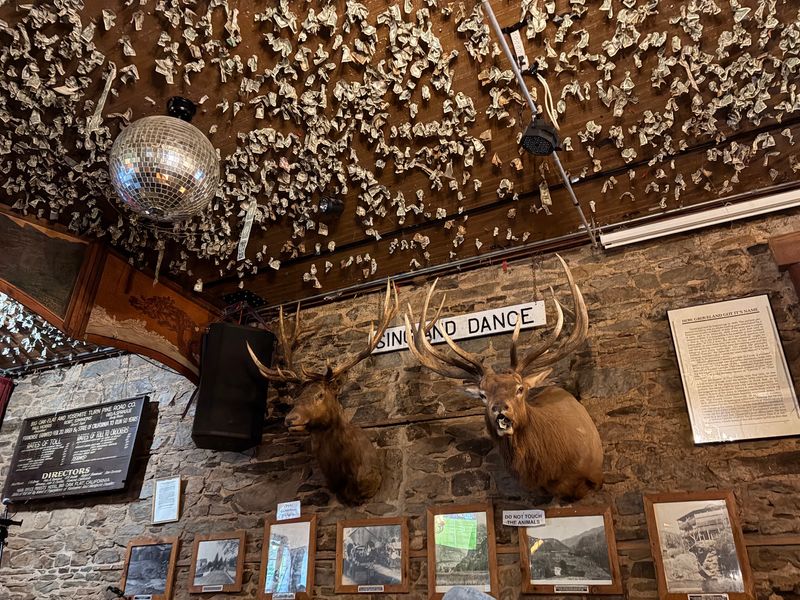 Dollar Bills on the Ceiling and Relics on the Walls