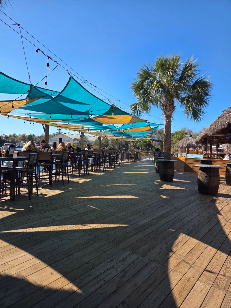 Several Tiki Bars, One Big Riverbank Several Tiki Bars, One Big Riverbank