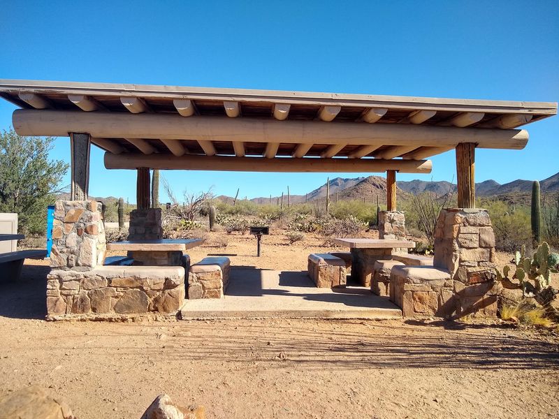 Shaded Tables and a Little Rock House Shaded Tables and a Little Rock House