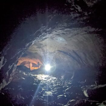 This Underground Arizona Lava Cave Hike Is Cooler, Darker, And Stranger Than Anything Above Ground