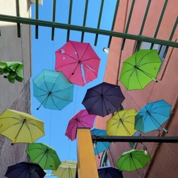 Rain Boots and Umbrellas Hang Over This Dreamy Little Alley in California Like a Storybook Sky