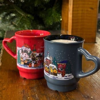 Best German Christmas Market foods with two gluhwein mugs on a table