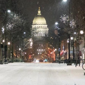 Wisconsin State Capitol building at night in the snow