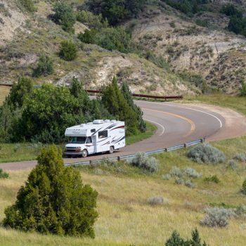 RV on road in Theodore Roosevelt National Park